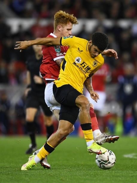 Morgan Gibbs-White of Wolverhampton Wanderers is tackled by Jack Colback of Nottingham Forest during the Carabao Cup Second Round match between...