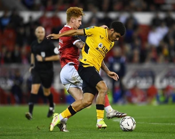 Morgan Gibbs-White of Wolverhampton Wanderers is tackled by Jack Colback of Nottingham Forest during the Carabao Cup Second Round match between...