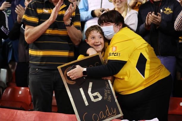 Young Wolverhampton Wanderers fans celebrates after being given a shirt by Conor Coady of Wolverhampton Wanderers during the Carabao Cup Second Round...