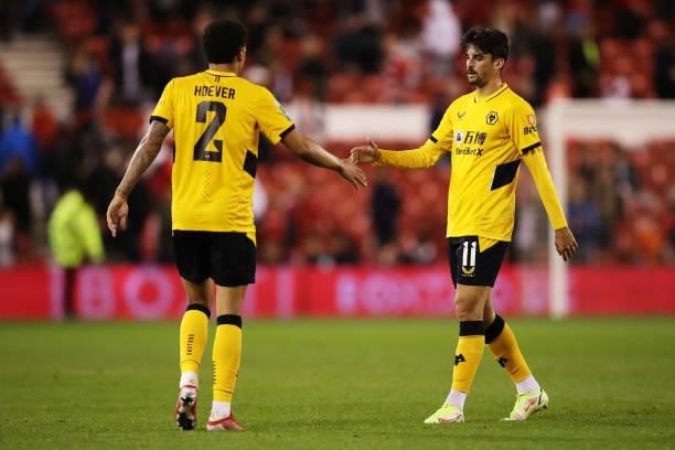 Francisco Trincao and Ki-Jana Hoever of Wolverhampton Wanderers celebrate their team's victory at full-time after the Carabao Cup Second Round match...