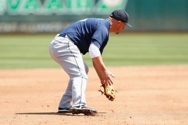 Kyle Seager of the Seattle Mariners is charged with a fielding error allowing Starling Marte of the Oakland Athletics to reach first base in the...