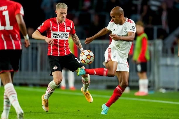 Philipp Max of PSV and Joao Mario of Benfica during the UEFA Champions League Play-Offs Leg Two match between PSV and Benfica at Philips Stadion on...