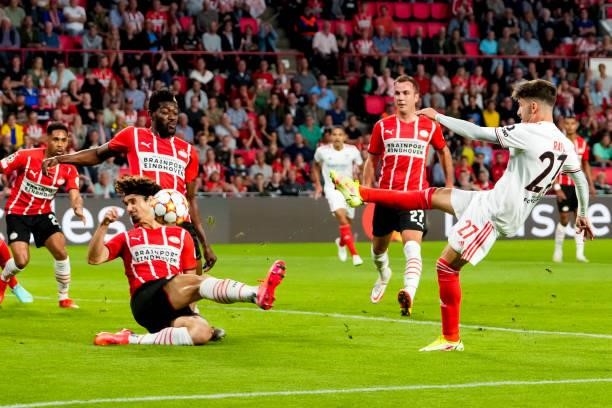 Andre Ramalho of PSV tries to block a shot at goal of Rafa Silva of Benfica during the UEFA Champions League Play-Offs Leg Two match between PSV and...