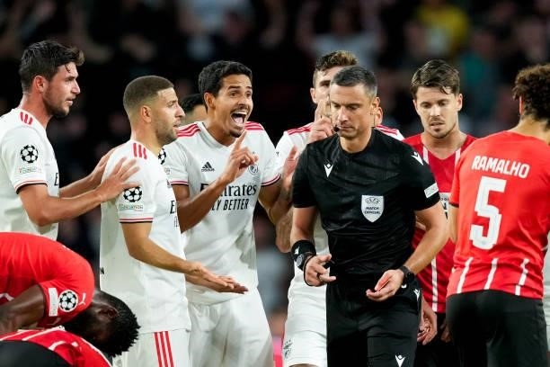 Lucas Verissimo of Benfica receives a straight red card from referee Slavko Vincic during the UEFA Champions League Play-Offs Leg Two match between...