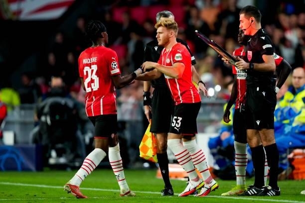 Noni Madueke of PSV is substituted for Yorbe Vertessen of PSV during the UEFA Champions League Play-Offs Leg Two match between PSV and Benfica at...