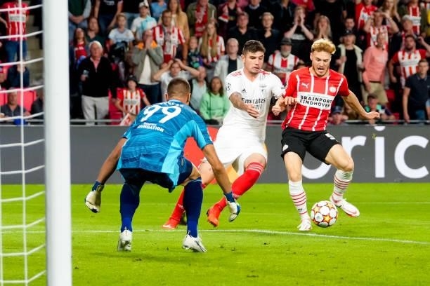 Odisseas Vlachodimos of Benfica, Morato of Benfica and Yorbe Vertessen of PSV during the UEFA Champions League Play-Offs Leg Two match between PSV...