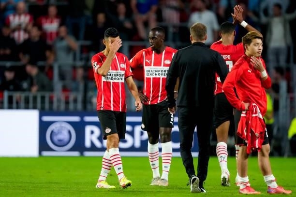 Eran Zahavi of PSV and Jordan Teze of PSV look dejected during the UEFA Champions League Play-Offs Leg Two match between PSV and Benfica at Philips...