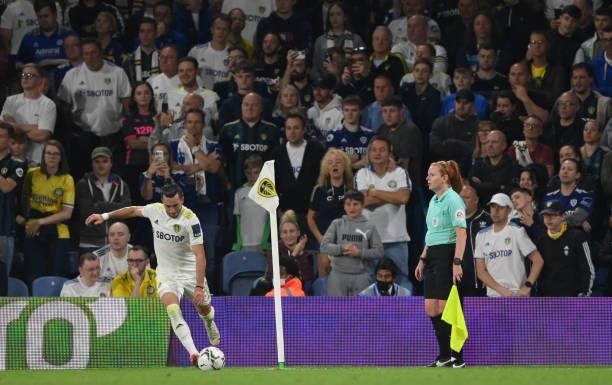 Assistant referee Helen Edwards looks on as Jack Harrison of Leeds takes a corner during the Carabao Cup Second Round match between Leeds United and...