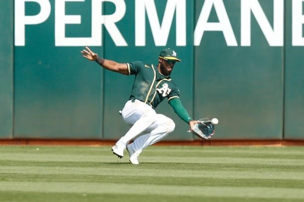Starling Marte of the Oakland Athletics catches a fly ball hit by Ty France of the Seattle Mariners in the top of the ninth inning at RingCentral...