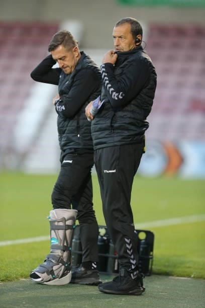 Northampton Town manager Jon Brady and assistant manager Colin Calderwood during the Carabao Cup 2nd Round match between Northampton Town and AFC...