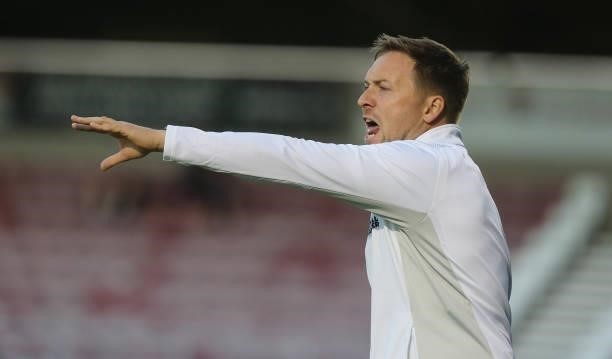 Wimbledon First Team Restarts Coach Andy Parslow looks on during the Carabao Cup 2nd Round match between Northampton Town and AFC Wimbledon at...