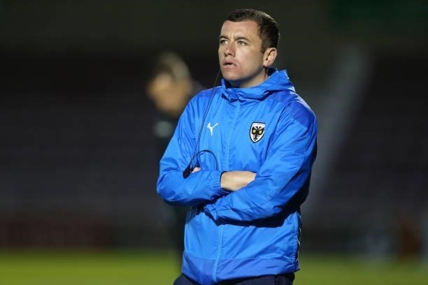 Wimbledon Assistant Head Coach Rob Turvey looks on during the Carabao Cup 2nd Round match between Northampton Town and AFC Wimbledon at Sixfields on...