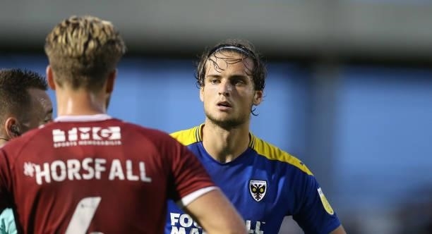 Aaron Pressley of AFC Wimbledon in action during the Carabao Cup 2nd Round match between Northampton Town and AFC Wimbledon at Sixfields on August...