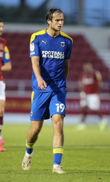 Aaron Pressley of AFC Wimbledon in action during the Carabao Cup 2nd Round match between Northampton Town and AFC Wimbledon at Sixfields on August...