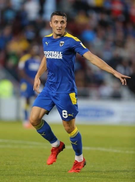 Anthony Hartigan of AFC Wimbledon in action during the Carabao Cup 2nd Round match between Northampton Town and AFC Wimbledon at Sixfields on August...