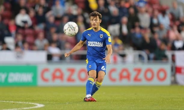 George Marsh of AFC Wimbledon in action during the Carabao Cup 2nd Round match between Northampton Town and AFC Wimbledon at Sixfields on August 24,...