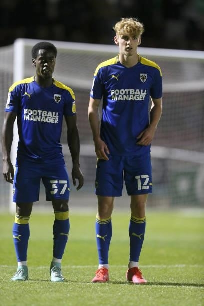 Paul Osew and Jack Rudoni of AFC Wimbledon line up to defend a free kick during the Carabao Cup 2nd Round match between Northampton Town and AFC...