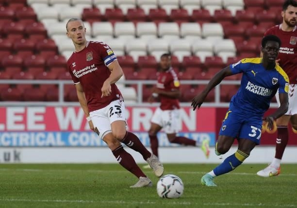 Joseph Mills of Northampton Town plays the ball during the Carabao Cup 2nd Round match between Northampton Town and AFC Wimbledon at Sixfields on...