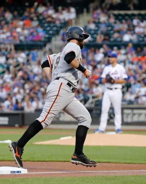 Brandon Belt of the San Francisco Giants runs the bases after his first inning home run against Tylor Megill of the New York Mets at Citi Field on...