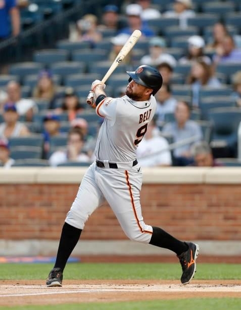 Brandon Belt of the San Francisco Giants follows through on his first inning home run against the New York Mets at Citi Field on August 24, 2021 in...
