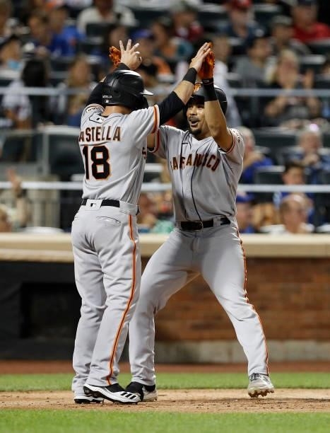 LaMonte Wade Jr. #31 of the San Francisco Giants celebrates his fourth inning two run home run against the New York Mets with teammate Tommy La...