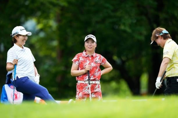 Karen Gondo, Kaori Makitani and Yuko Fukuda of Japan interact during the first round of the San-In Goen Musubi Ladies at Daisenheigen Golf Club on...