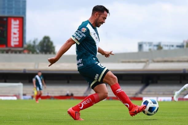 George Corral of Puebla kicks the ball during the 6th round match between Pumas UNAM and Puebla as part of the Torneo Grita Mexico A21 Liga MX at...