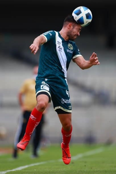 George Corral of Puebla heads the ball during the 6th round match between Pumas UNAM and Puebla as part of the Torneo Grita Mexico A21 Liga MX at...