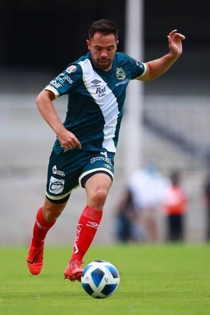 George Corral of Puebla drives the ball during the 6th round match between Pumas UNAM and Puebla as part of the Torneo Grita Mexico A21 Liga MX at...