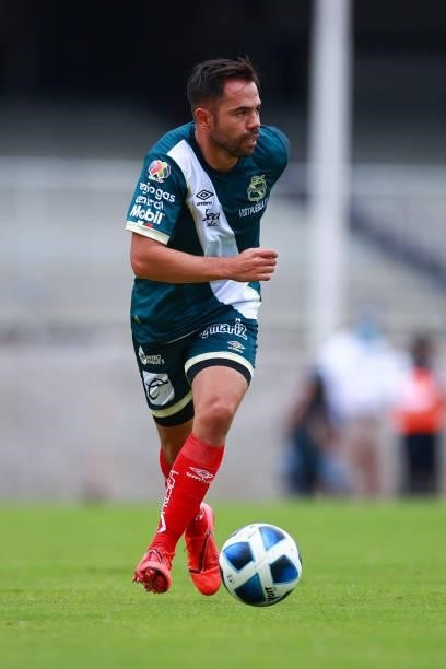 George Corral of Puebla drives the ball during the 6th round match between Pumas UNAM and Puebla as part of the Torneo Grita Mexico A21 Liga MX at...