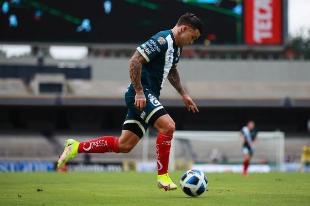 Christian Tabo of Puebla drives the ball during the 6th round match between Pumas UNAM and Puebla as part of the Torneo Grita Mexico A21 Liga MX at...