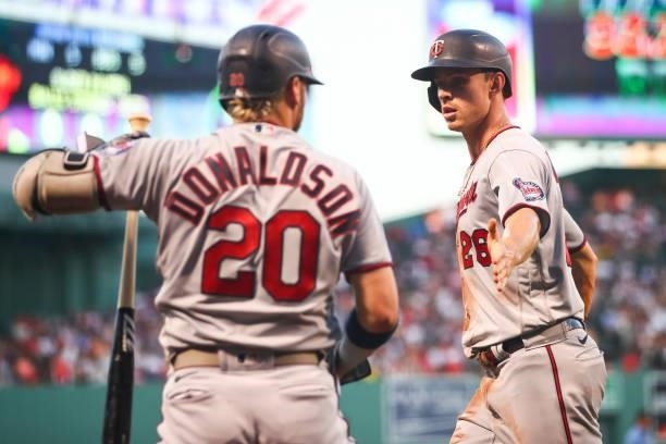 Max Kepler of the Minnesota Twins score I the first inning of a game against teh Boston Red Sox at Fenway Park on August 24, 2021 in Boston,...