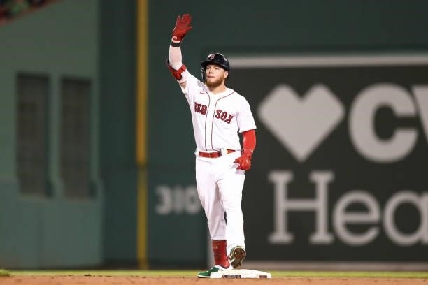Alex Verdugo of the Boston Red Sox reacts after hitting a double in the fourth inning of a game against the Minnesota Twins at Fenway Park on August...
