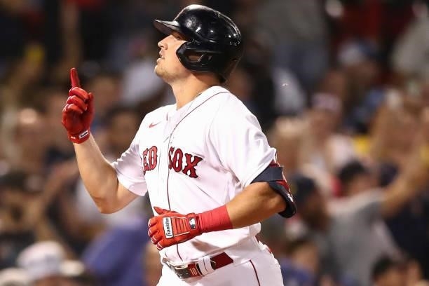 Hunter Renfroe of the Boston Red Sox reacts as he crosses home plate after hitting a solo home run in the fifth inning of a game against the...