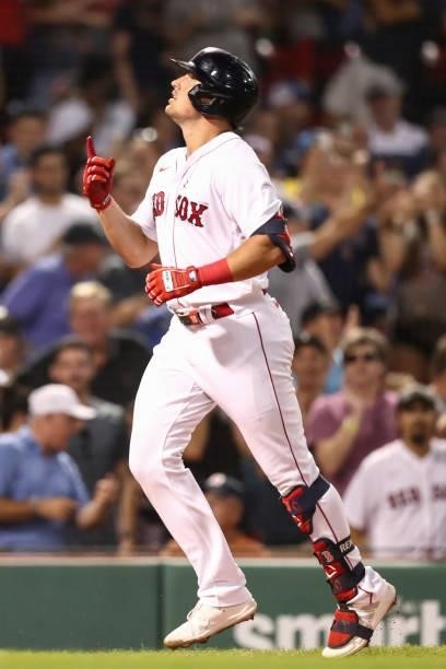 Hunter Renfroe of the Boston Red Sox reacts as he crosses home plate after hitting a solo home run in the fifth inning of a game against the...