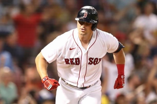 Hunter Renfroe of the Boston Red Sox reacts after hitting a solo home run in the fifth inning of a game against the Minnesota Twins at Fenway Park on...