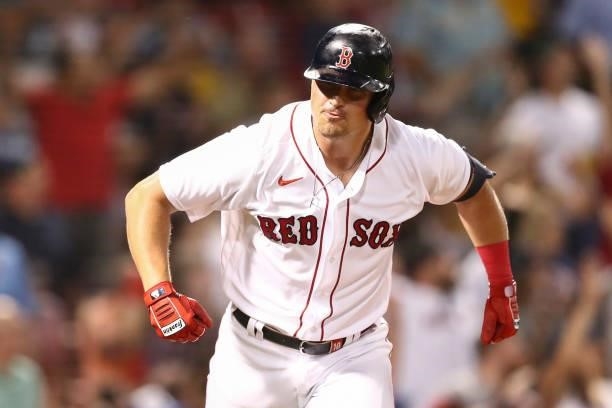 Hunter Renfroe of the Boston Red Sox reacts after hitting a solo home run in the fifth inning of a game against the Minnesota Twins at Fenway Park on...