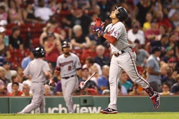 Jorge Polanco of the Minnesota Twins crosses home plate after hitting a home run in the seventh inning of a game against the Boston Red Sox at Fenway...