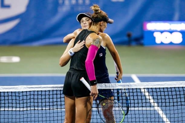 Irina-Camelia Begu of Romania and Polona Hercog of Slovenia hug after their match on day 3 of the Cleveland Championships at Jacobs Pavilion on...
