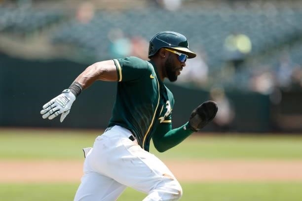 Starling Marte of the Oakland Athletics rounds the bases to score on a single by Mitch Moreland in the bottom of the first inning against the Seattle...