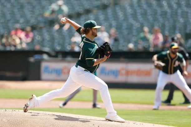 Cole Irvin of the Oakland Athletic pitches in the top of the first inning against the Seattle Mariners at RingCentral Coliseum on August 24, 2021 in...