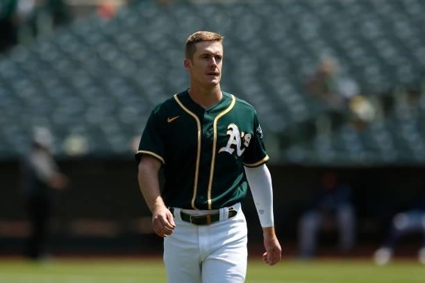 Mark Canha of the Oakland Athletics looks on between innings during the game against the Seattle Mariners at RingCentral Coliseum on August 24, 2021...