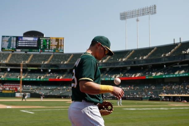 Third baseman Matt Chapman of the Oakland Athletics looks on after catching a pop-up in foul territory by Kyle Seager of the Seattle Mariners in the...