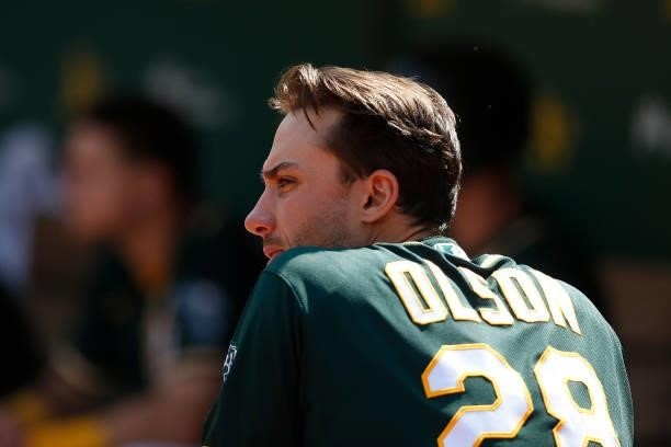 Matt Olson of the Oakland Athletics looks on from the dugout against the Seattle Mariners at RingCentral Coliseum on August 24, 2021 in Oakland,...