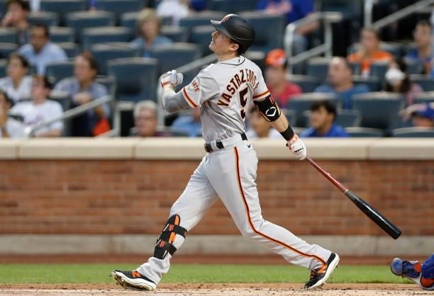 Mike Yastrzemski of the San Francisco Giants follows through on his second inning two run home run against the New York Mets at Citi Field on August...