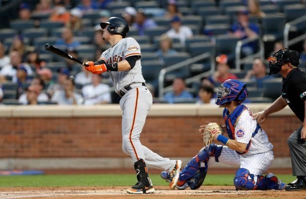 Wilmer Flores of the San Francisco Giants doubles in the second inning against the New York Mets at Citi Field on August 24, 2021 in New York City....