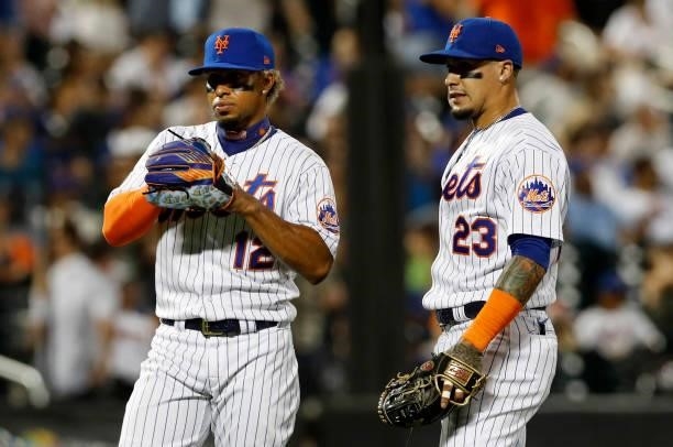 Francisco Lindor and Javier Baez of the New York Mets prepare for the start of the seventh inning against the San Francisco Giants at Citi Field on...