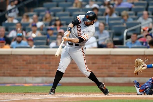 Brandon Belt of the San Francisco Giants connects on his first inning home run against the New York Mets at Citi Field on August 24, 2021 in New York...