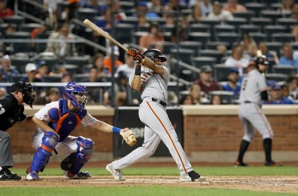 LaMonte Wade Jr. #31 of the San Francisco Giants follows through on his fourth inning two run home run against the New York Mets at Citi Field on...