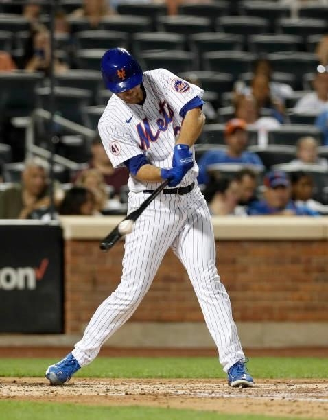 Tylor Megill of the New York Mets connects on a double in the third inning against the San Francisco Giants at Citi Field on August 24, 2021 in New...